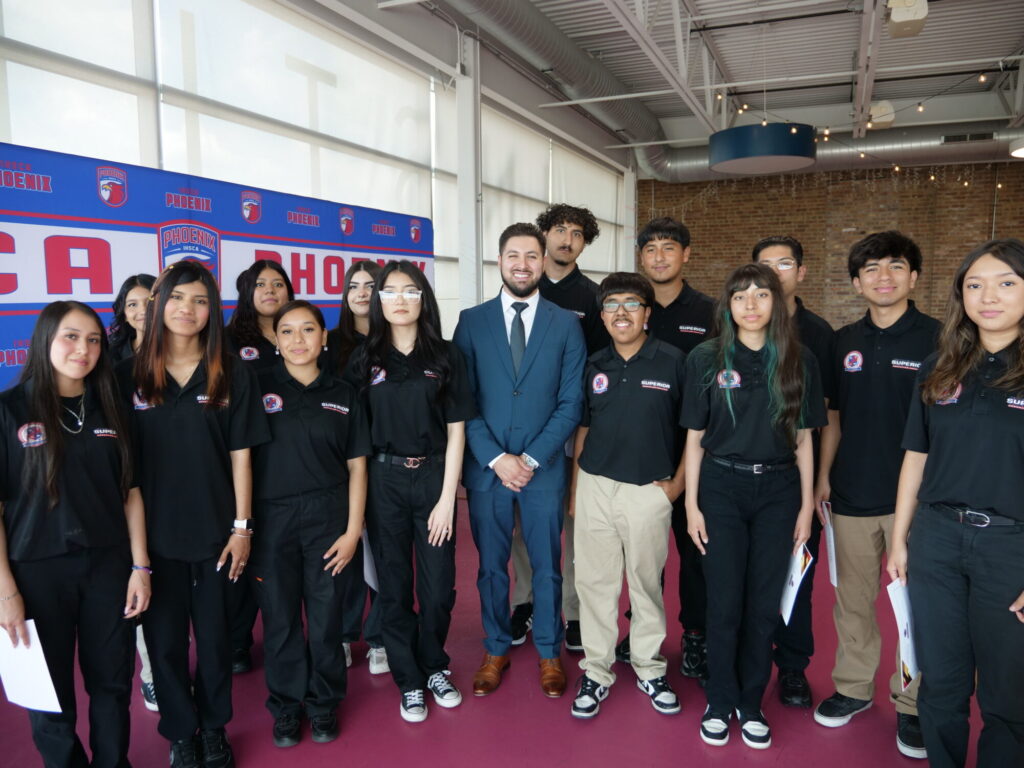 Instructor Marco Patino with graduates of the EMR program