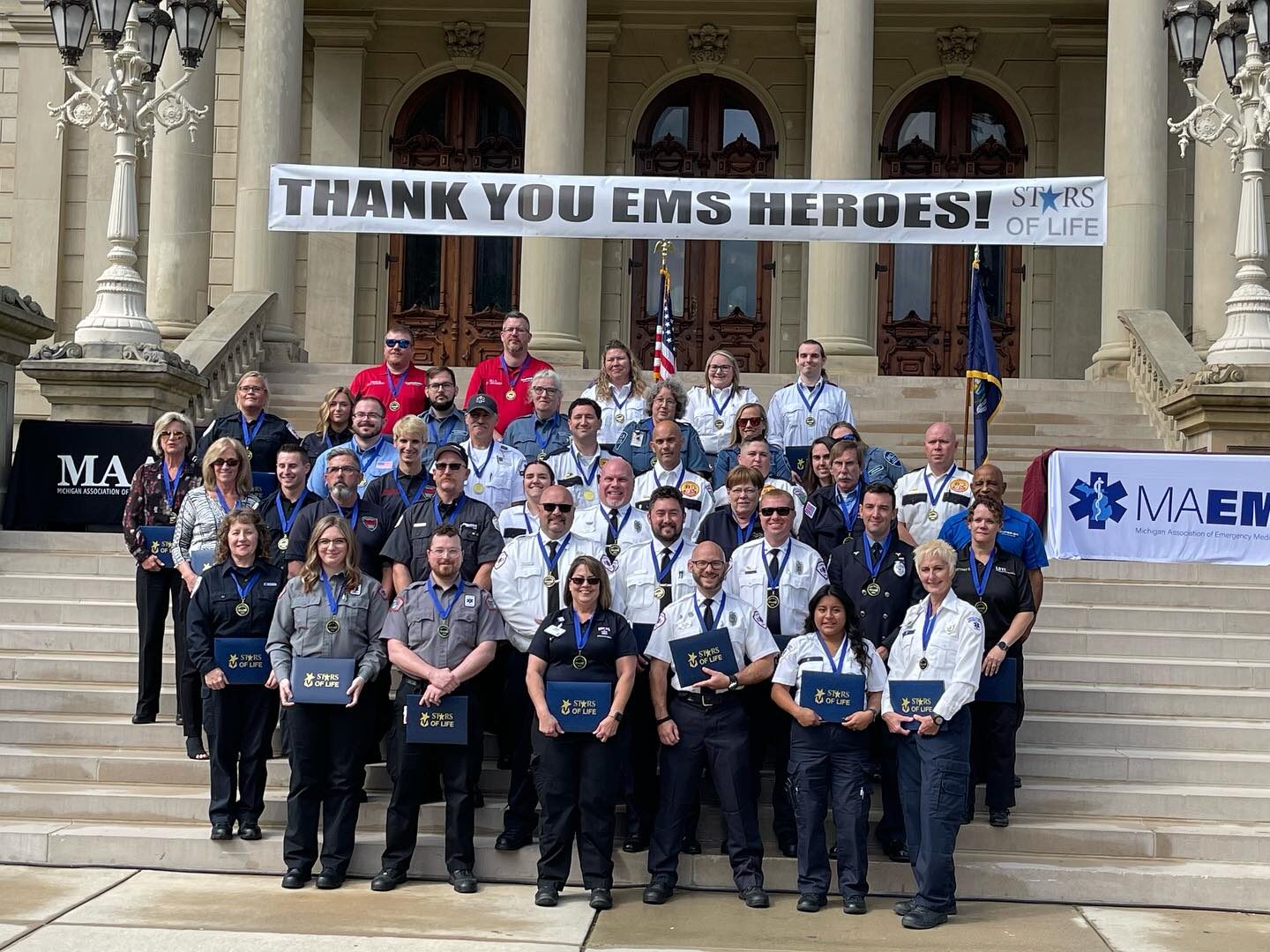 Group of Superior Ambulance of Michigan employees receive Stars of Life Award.