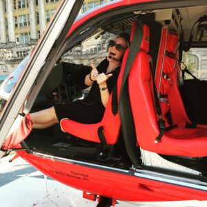 Ali smiling in a Superior helicopter