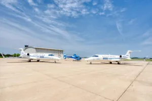 Blue Helicopter with 2 Learjets