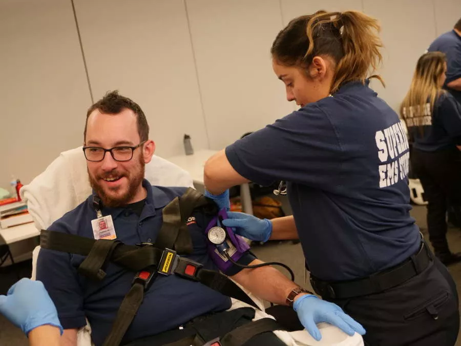 EMT Student Checking Student's Blood Pressure