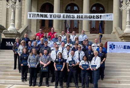 Group of Superior Ambulance of Michigan employees receive Stars of Life Award.