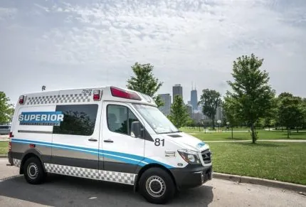 White superior ambulance in front of the city of Chicago.