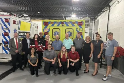 Superior Ambulance Celebrates Opening of New Burlington Station Wisconsin employees standing in front of an ambulance