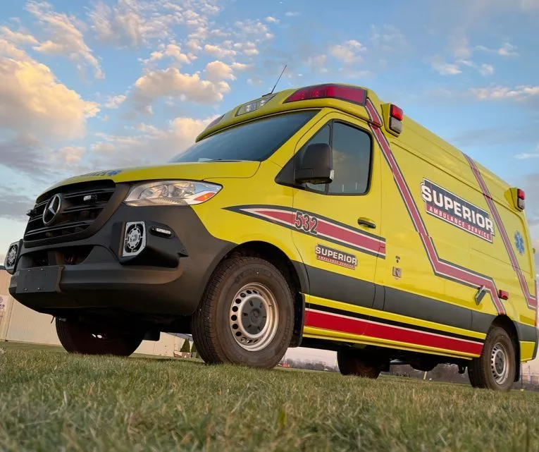 ground view of yellow ambulance